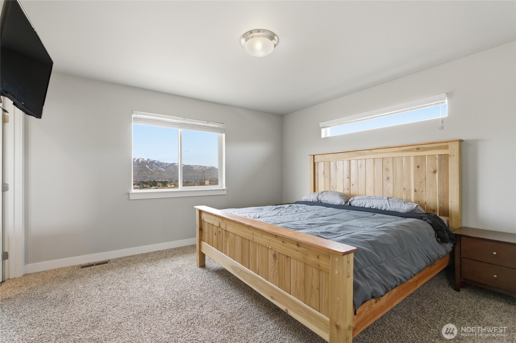 2247 S. Mystical Loop East Wenatchee, WA 98802 - Photo 10 of 25 a bedroom with a bed and a window