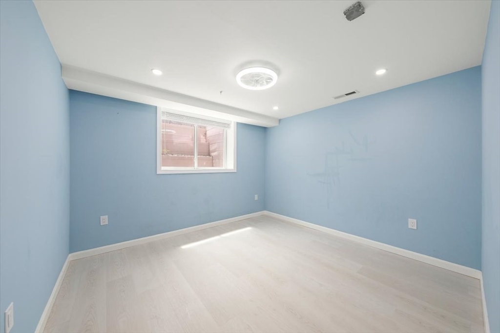 6 Bates Street, Unit A Devens, MA 01434 - Photo 32 of 41 an empty room with a window