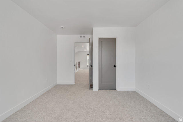 1302 1475 East, Unit 40 Payson, UT 84651 - Photo 28 of 34 Spare room with light carpet and baseboards
