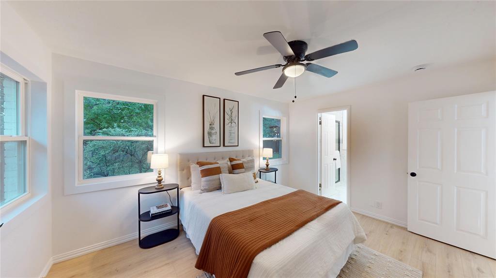 409 Vicki Place Hurst, TX 76053 - Photo 14 of 30 a bedroom with a bed and a window