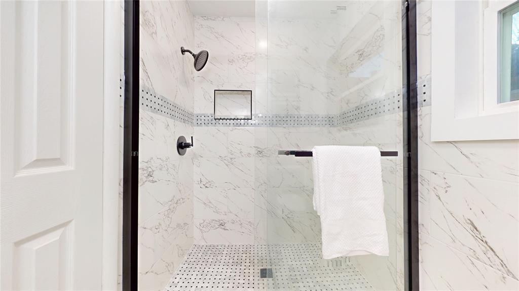 409 Vicki Place Hurst, TX 76053 - Photo 16 of 30 a bathroom with a shower