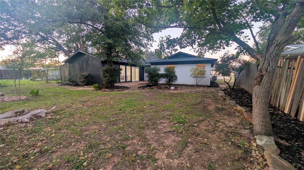 409 Vicki Place Hurst, TX 76053 - Photo 27 of 30 a view of a house with a yard