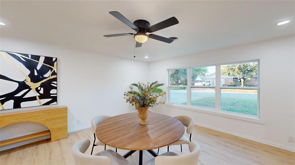 409 Vicki Place Hurst, TX 76053 - Photo 8 of 30 a view of a dining room with furniture and a potted plant
