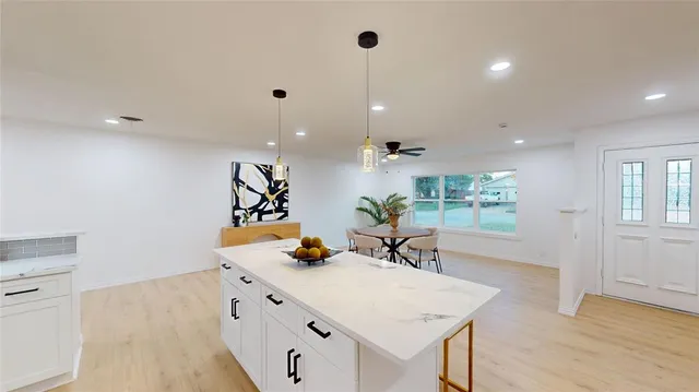 a view of a center island and living room