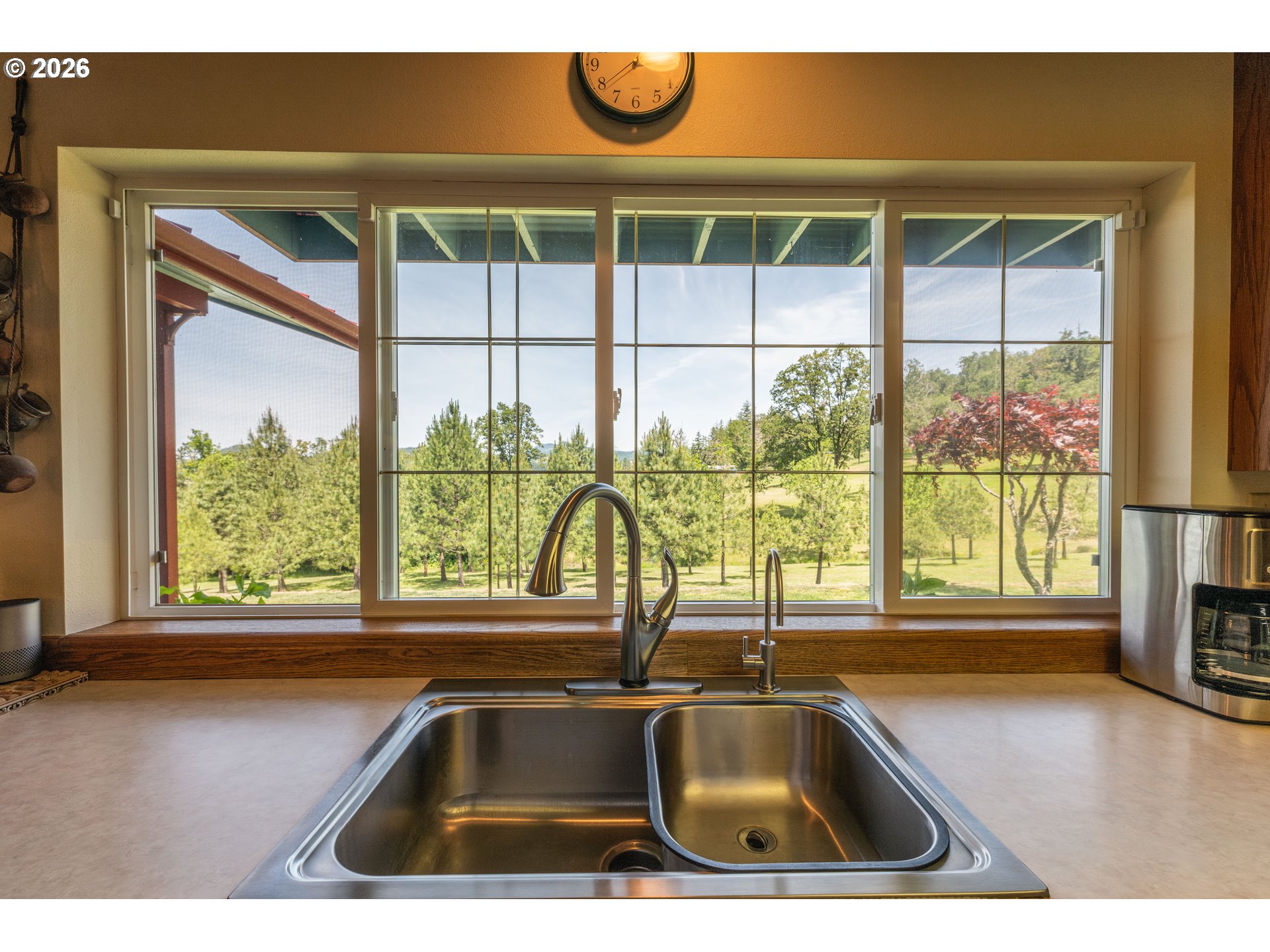 489 Fir Vista Road Sutherlin, OR 97479 - Photo 9 of 47 a kitchen with a sink and a large window