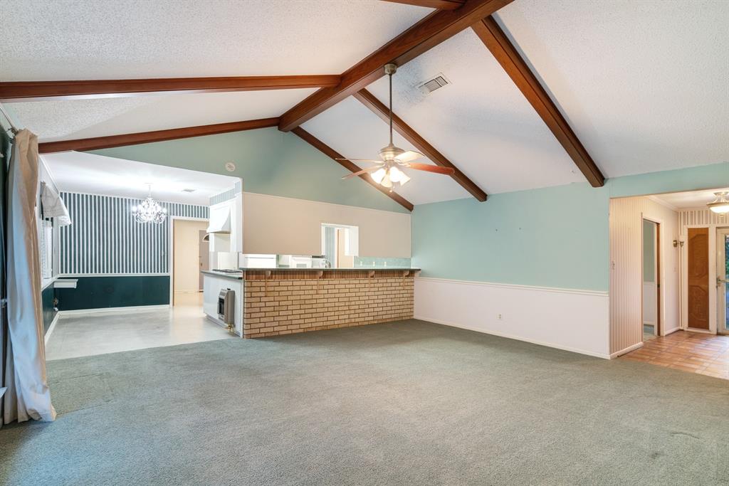 3345 West Kaufman Street Paris, TX 75460 - Photo 6 of 17 a view of an empty room with a window
