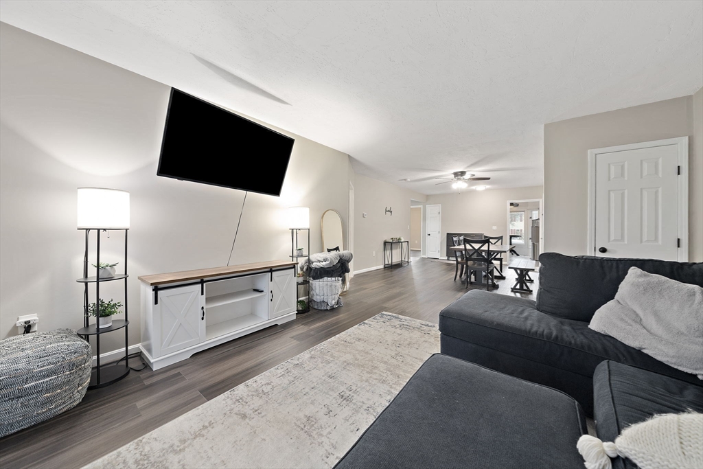 22 Union Square, Unit 22 Randolph, MA 02368 - Photo 15 of 28 a living room with furniture and a flat screen tv