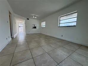 a view of an empty room with a window