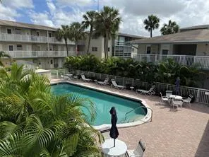 a view of a swimming pool with a patio