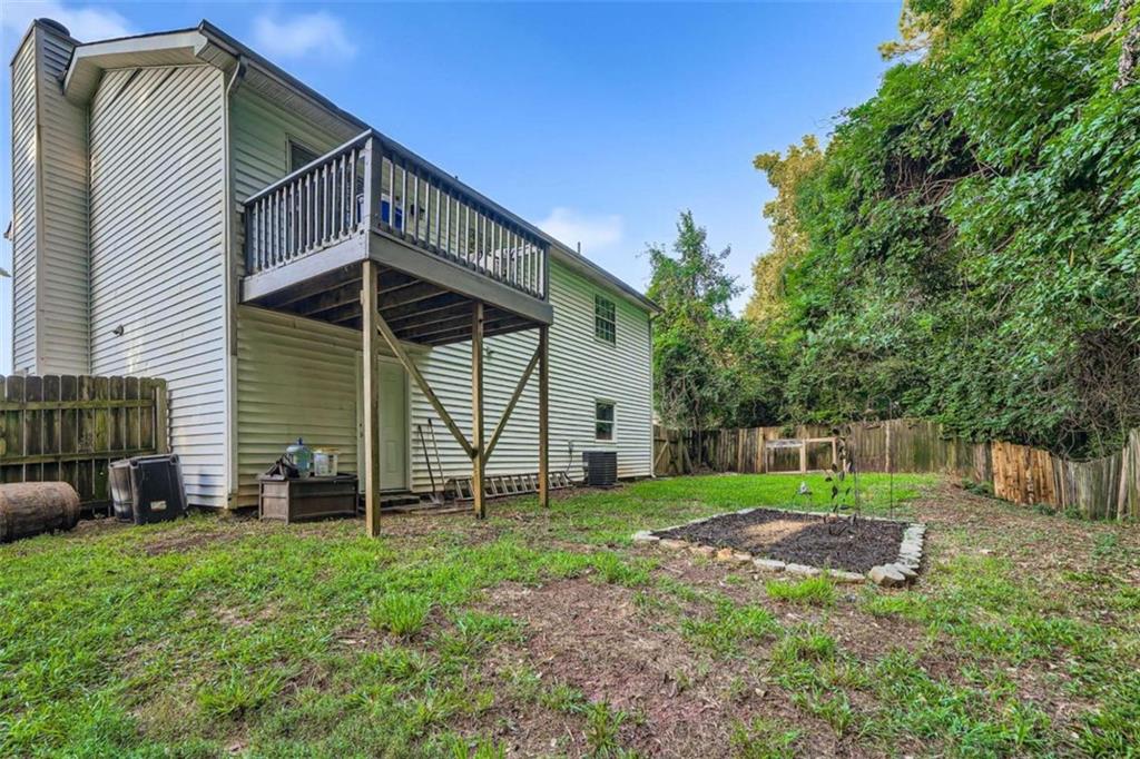 1607 Sweetgum Hill Decatur, GA 30032 - Photo 12 of 25 a view of a chair and table in backyard of the house