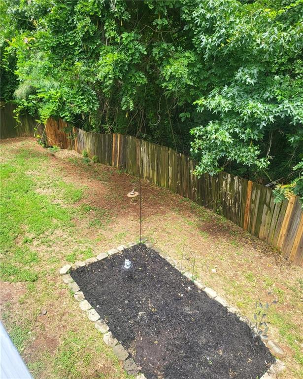 1607 Sweetgum Hill Decatur, GA 30032 - Photo 15 of 25 a backyard with wooden fence