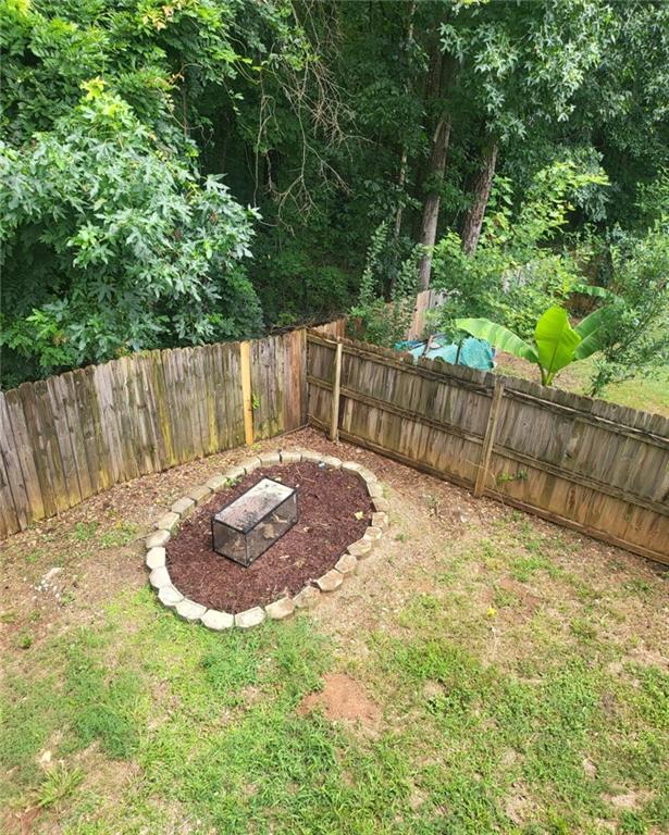 1607 Sweetgum Hill Decatur, GA 30032 - Photo 17 of 25 a garden view with wooden fence
