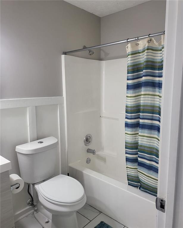 1607 Sweetgum Hill Decatur, GA 30032 - Photo 18 of 25 a bathroom with a toilet and a shower