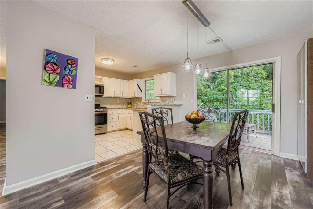 1607 Sweetgum Hill Decatur, GA 30032 - Photo 2 of 25 a view of a dining room with furniture window and outside view