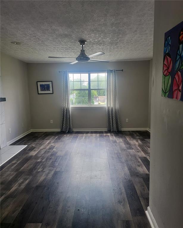 1607 Sweetgum Hill Decatur, GA 30032 - Photo 23 of 25 an empty room with wooden floor and windows