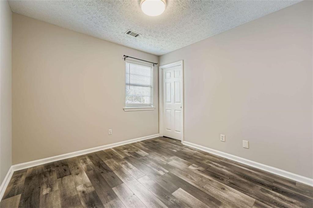 1607 Sweetgum Hill Decatur, GA 30032 - Photo 8 of 25 an empty room with windows