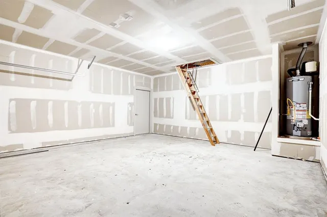 a view of an empty room with stairs