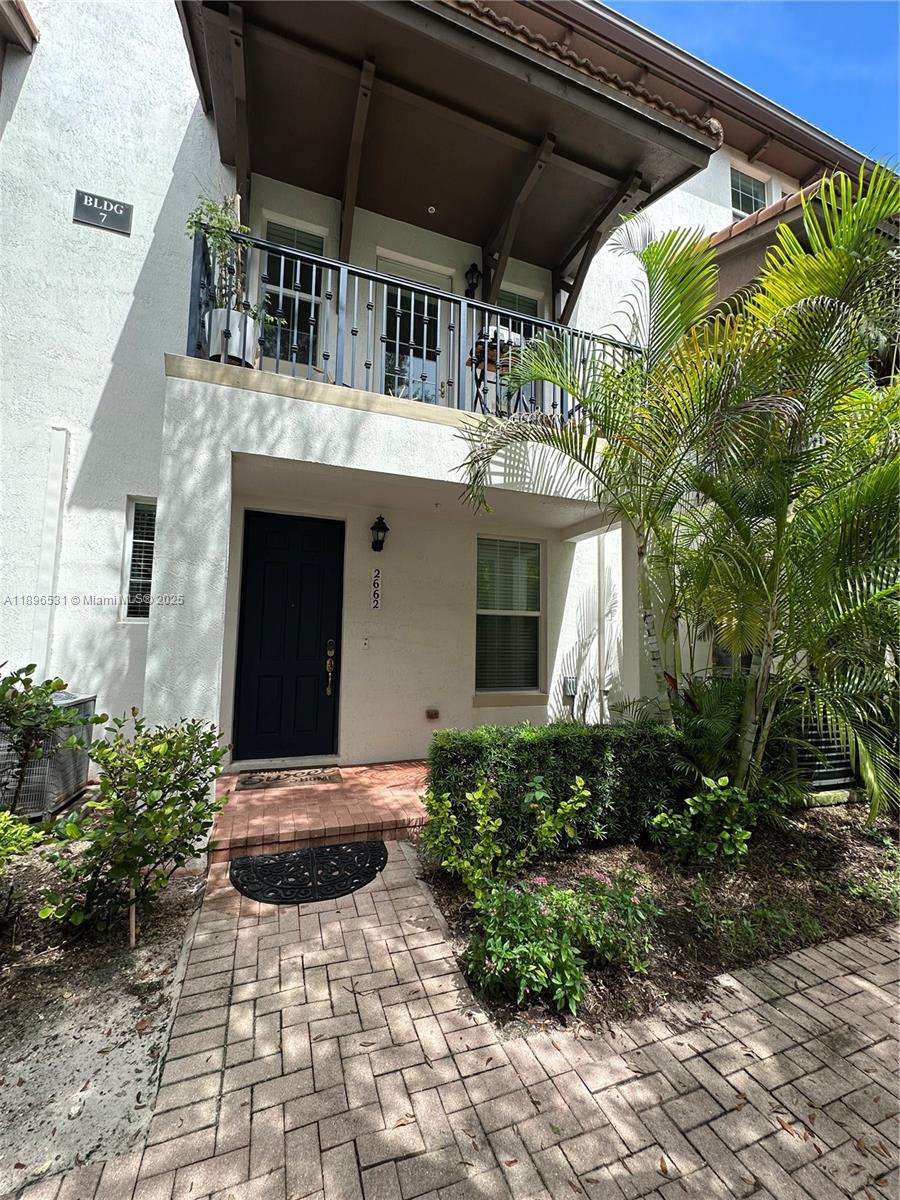 a view of entryway with flower pots