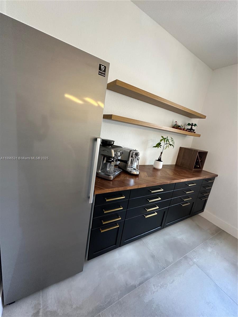 2662 Southwest 118 Road, Unit 2662 Miramar, FL 33025 - Photo 11 of 37 a room with toys and wooden floor