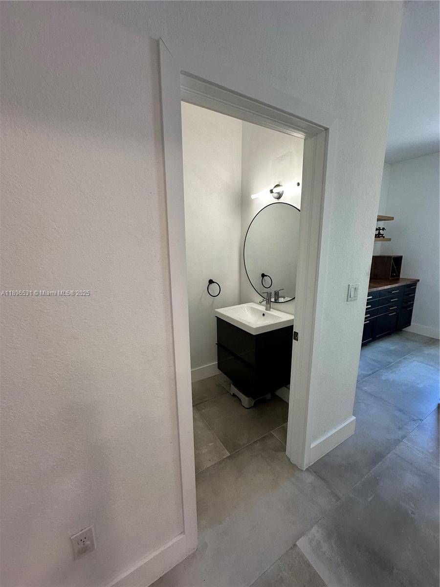 2662 Southwest 118 Road, Unit 2662 Miramar, FL 33025 - Photo 14 of 37 a en suite bathroom with a sink and a mirror