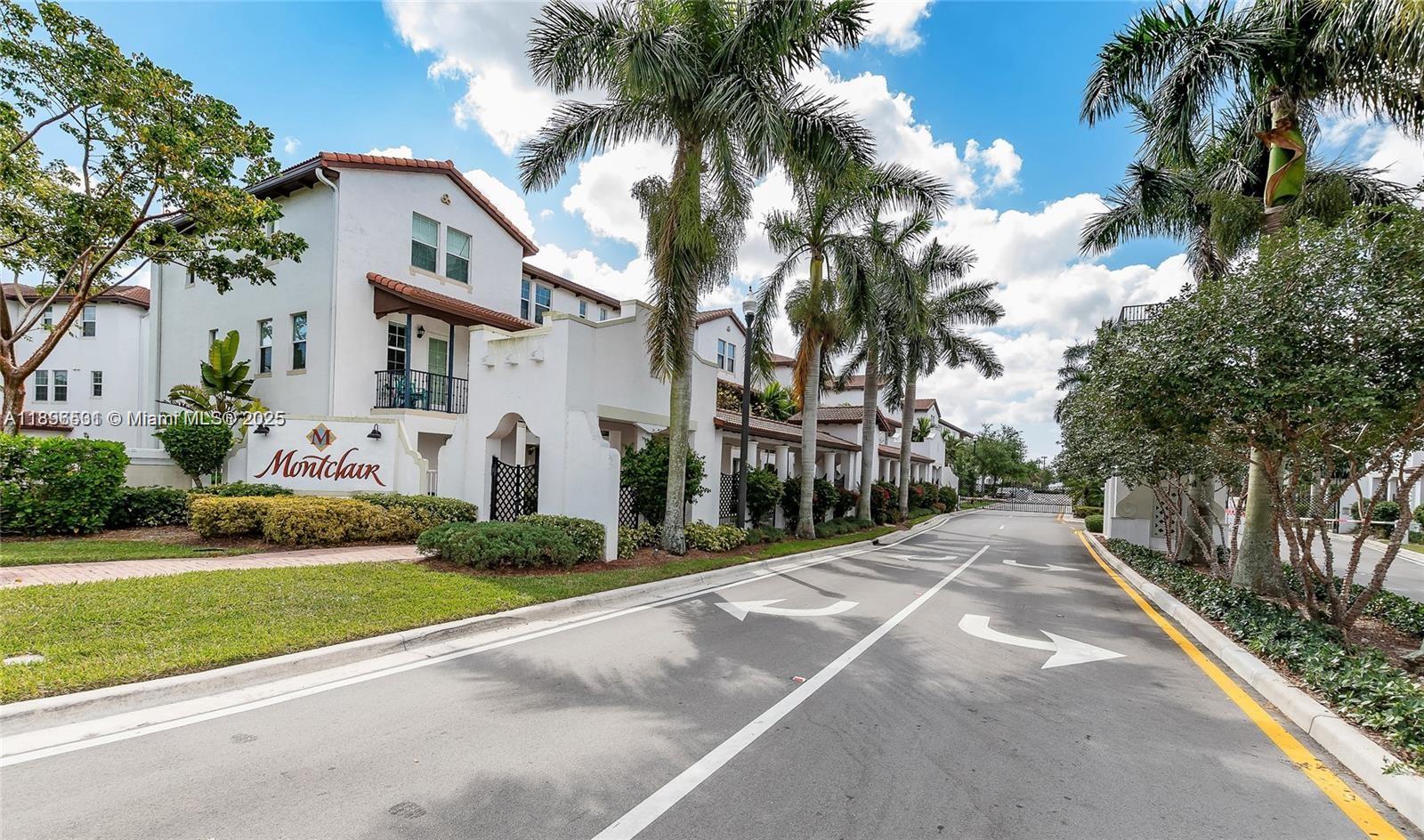 2662 Southwest 118 Road, Unit 2662 Miramar, FL 33025 - Photo 2 of 37 a front view of house with yard and green space
