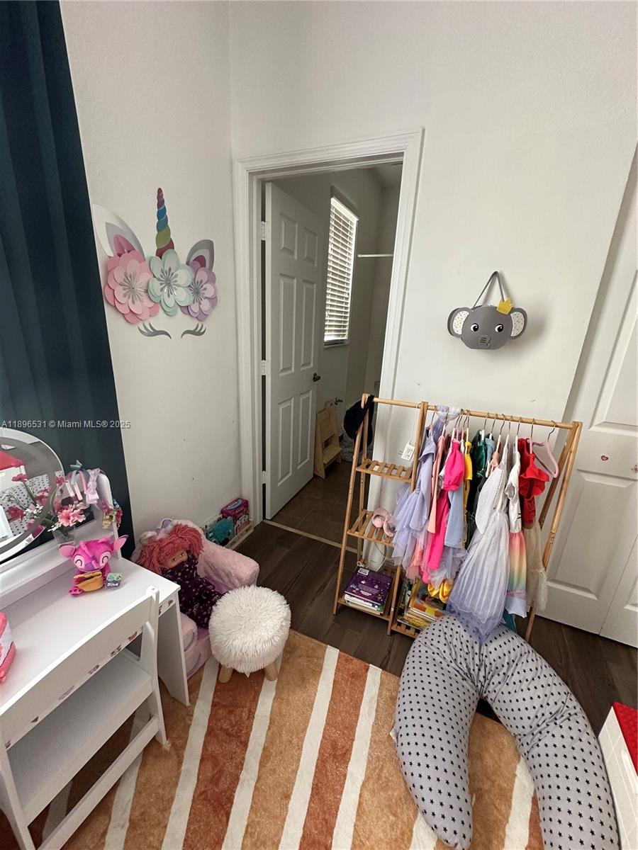 2662 Southwest 118 Road, Unit 2662 Miramar, FL 33025 - Photo 29 of 37 a bedroom with a bed and a couch