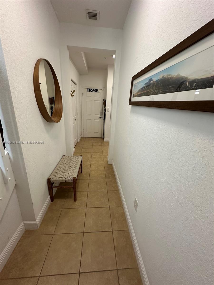 2662 Southwest 118 Road, Unit 2662 Miramar, FL 33025 - Photo 3 of 37 a bathroom with a sink and a mirror