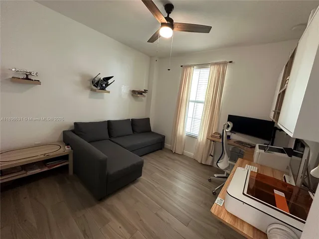 a living room with furniture and a window