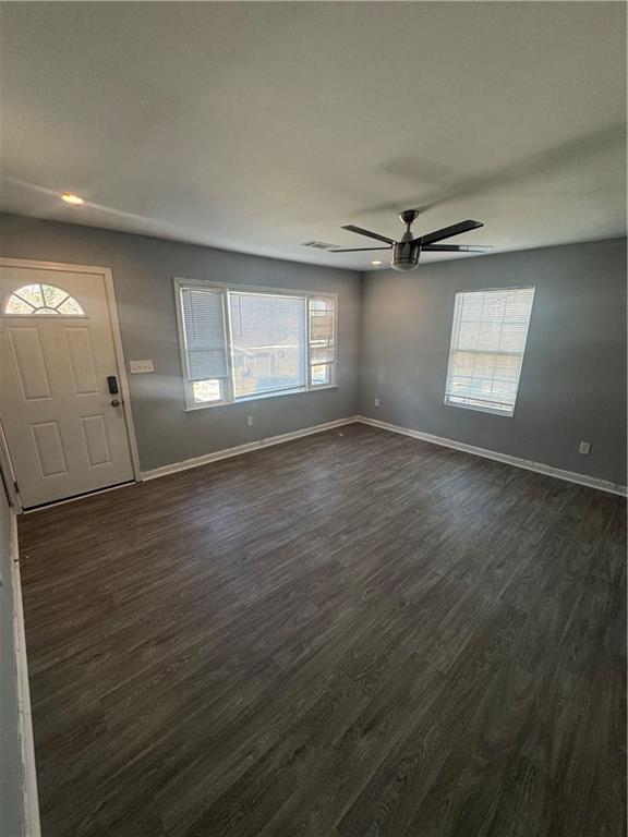 248 Upshaw Street Southwest Atlanta, GA 30315 - Photo 2 of 8 an empty room with wooden floor and windows