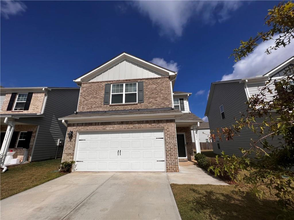 11371 Kilpatrick Lane Hampton, GA 30228 - Photo 1 of 1 a front view of a house with a yard