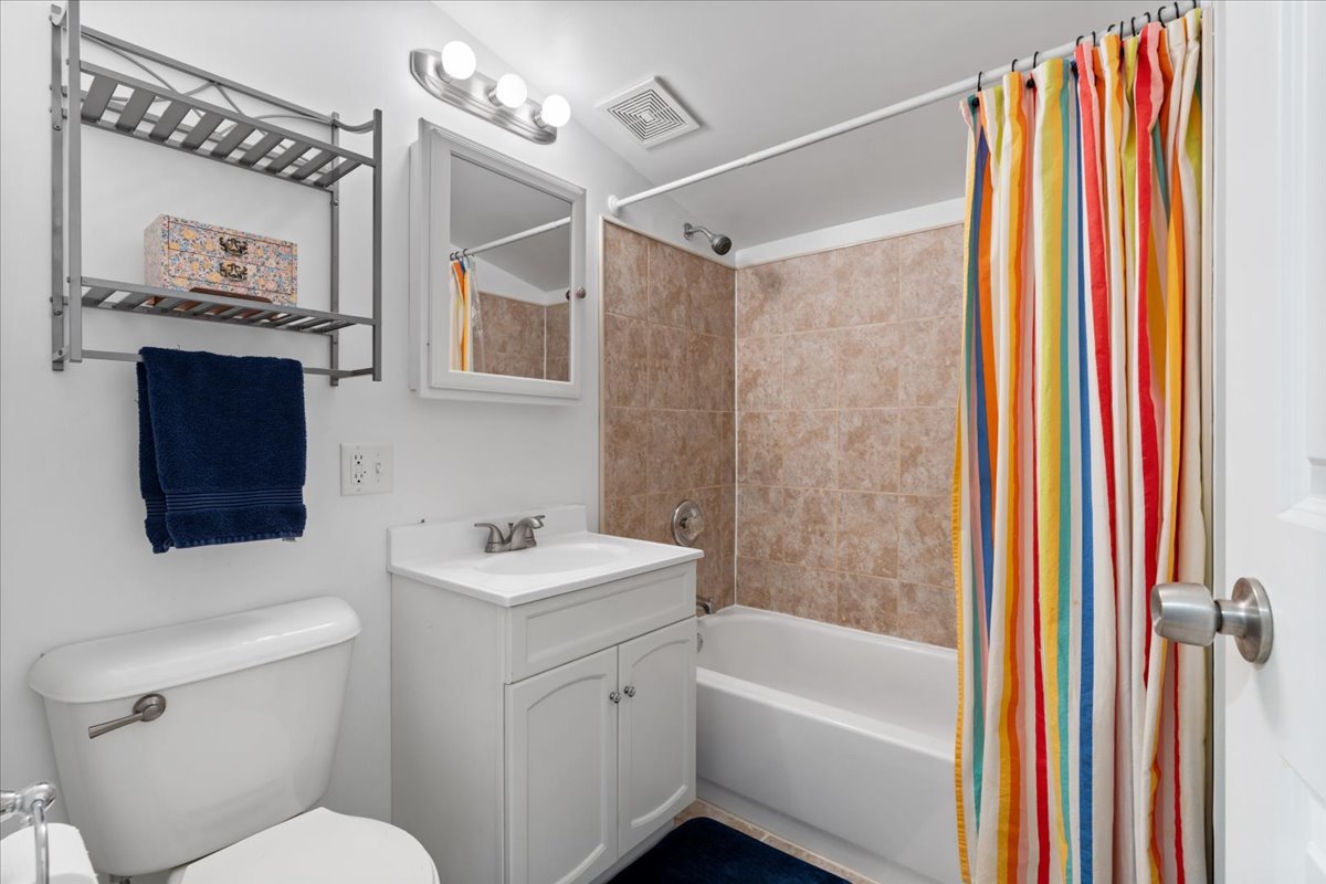 2735 North Ridgeway Avenue Chicago, IL 60647 - Photo 19 of 40 a bathroom with a sink toilet and shower