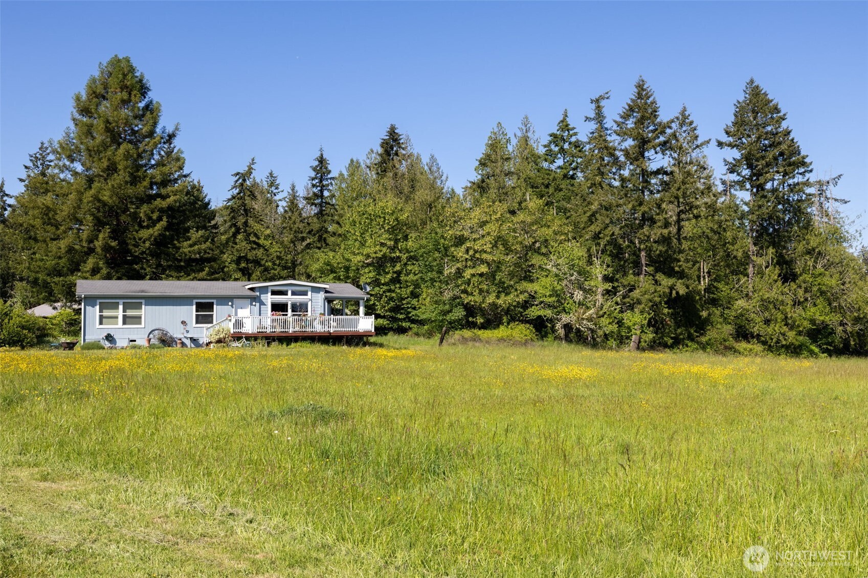 1716 304th Street East Roy, WA 98580 - Photo 12 of 21 a front view of a house with a yard