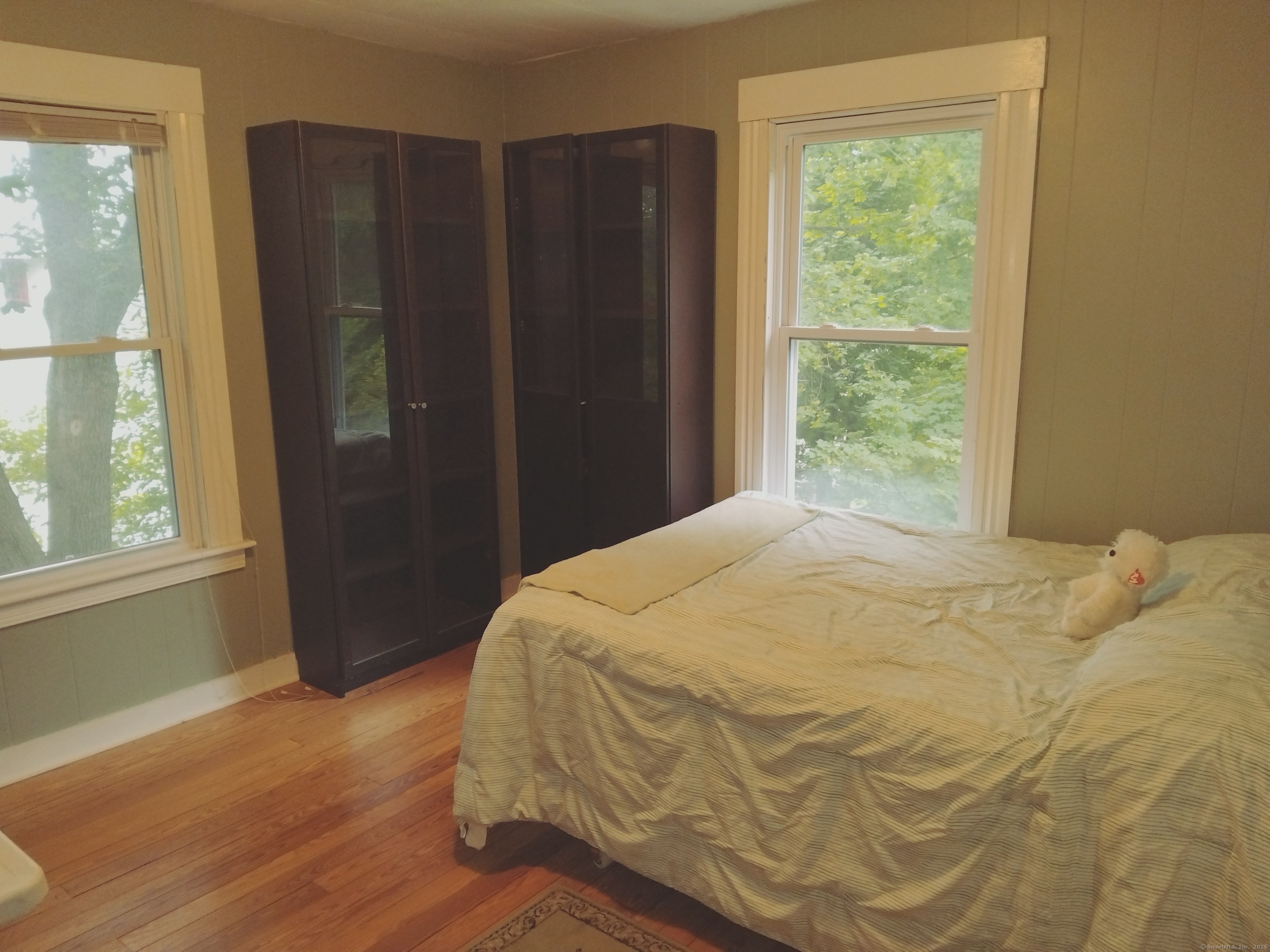 21 Roosevelt Avenue Torrington, CT 06790 - Photo 13 of 22 a bed sitting in a bedroom next to a window