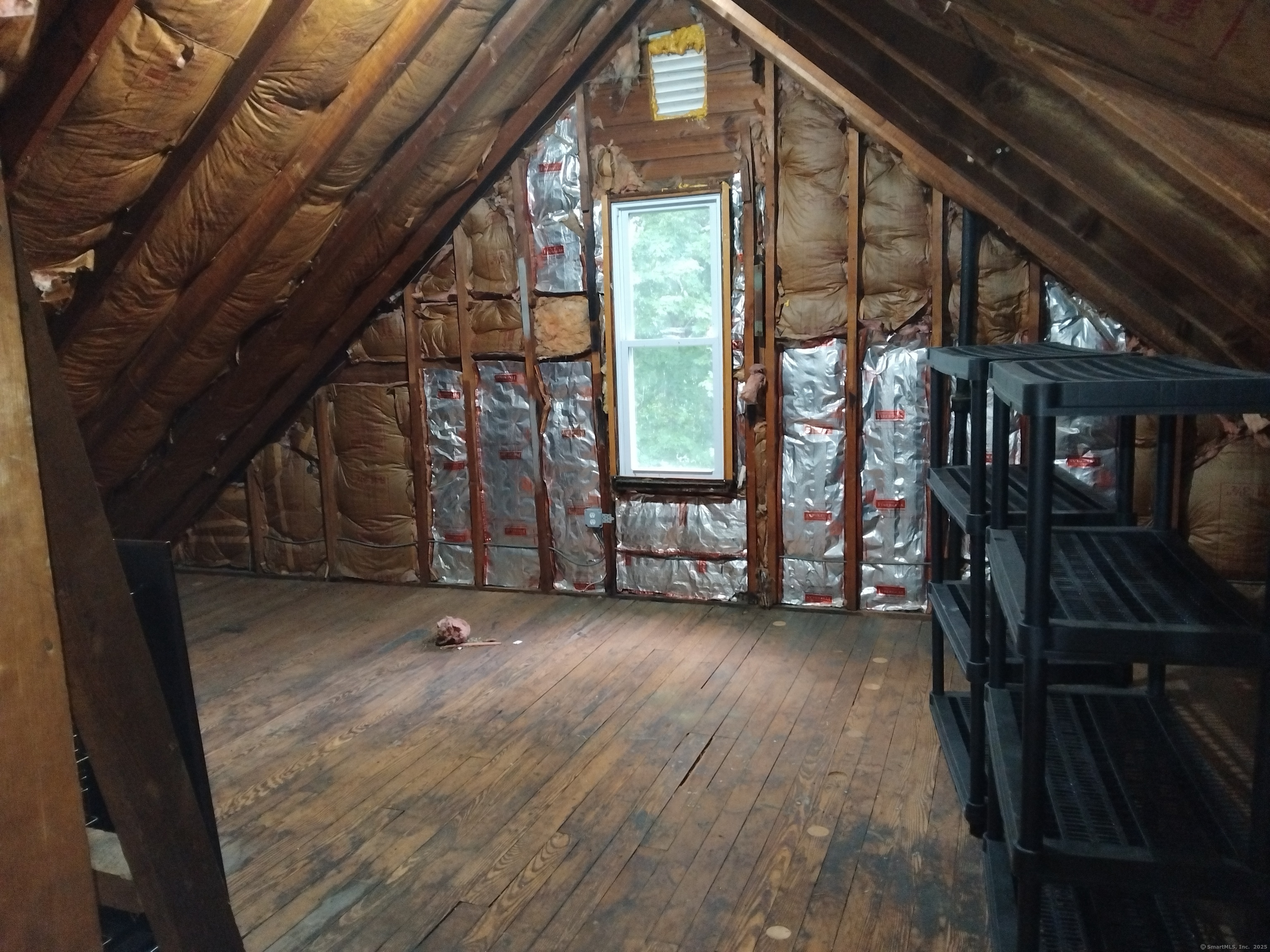 21 Roosevelt Avenue Torrington, CT 06790 - Photo 18 of 22 a view of an empty room with wooden floor and stairs