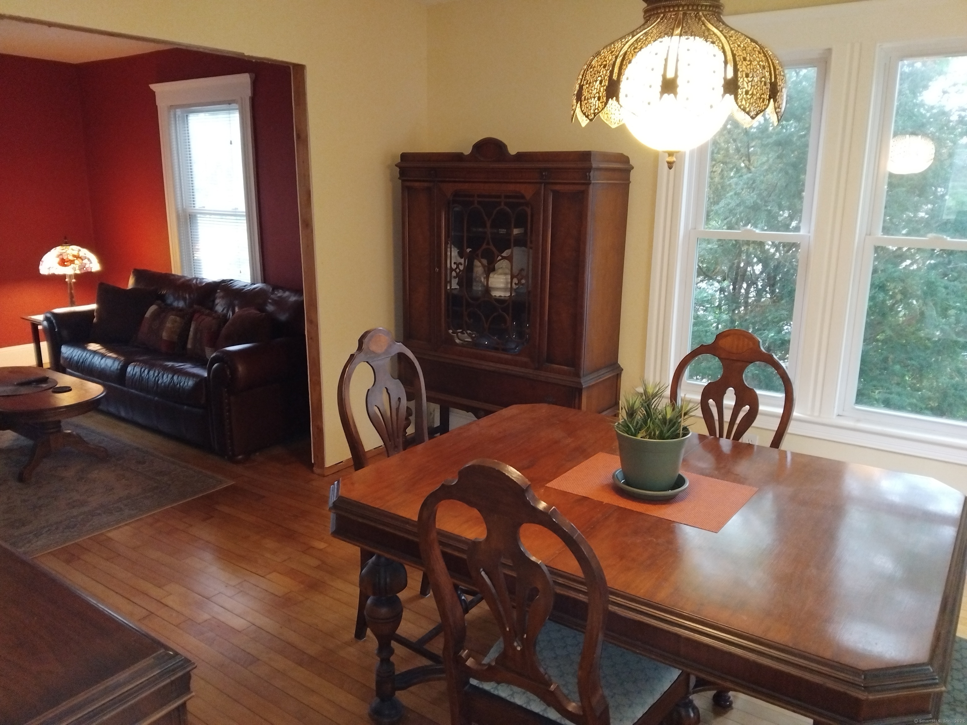 21 Roosevelt Avenue Torrington, CT 06790 - Photo 6 of 22 a view of a dining room with furniture window and wooden floor