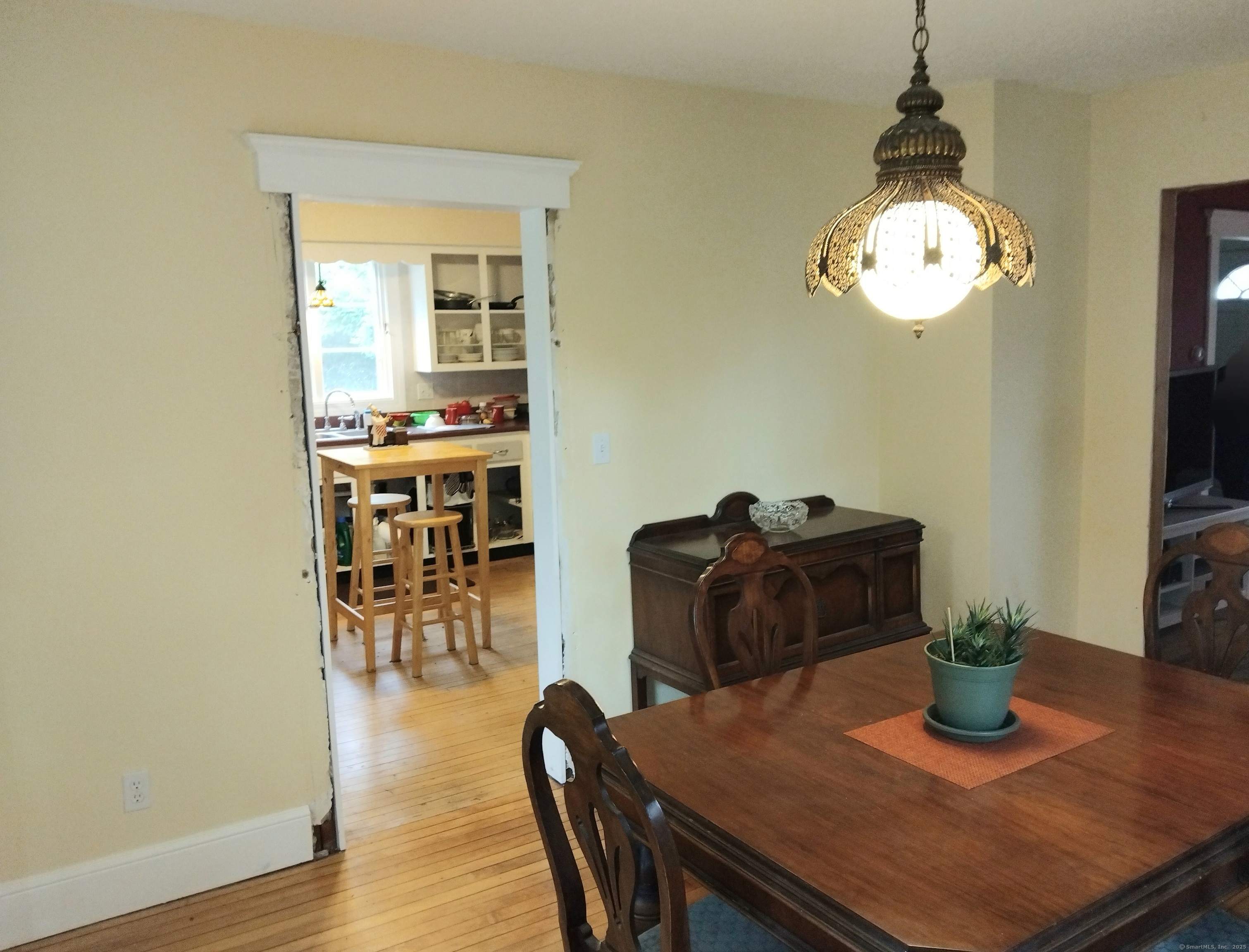 21 Roosevelt Avenue Torrington, CT 06790 - Photo 7 of 22 a view of a dining room with furniture and wooden floor