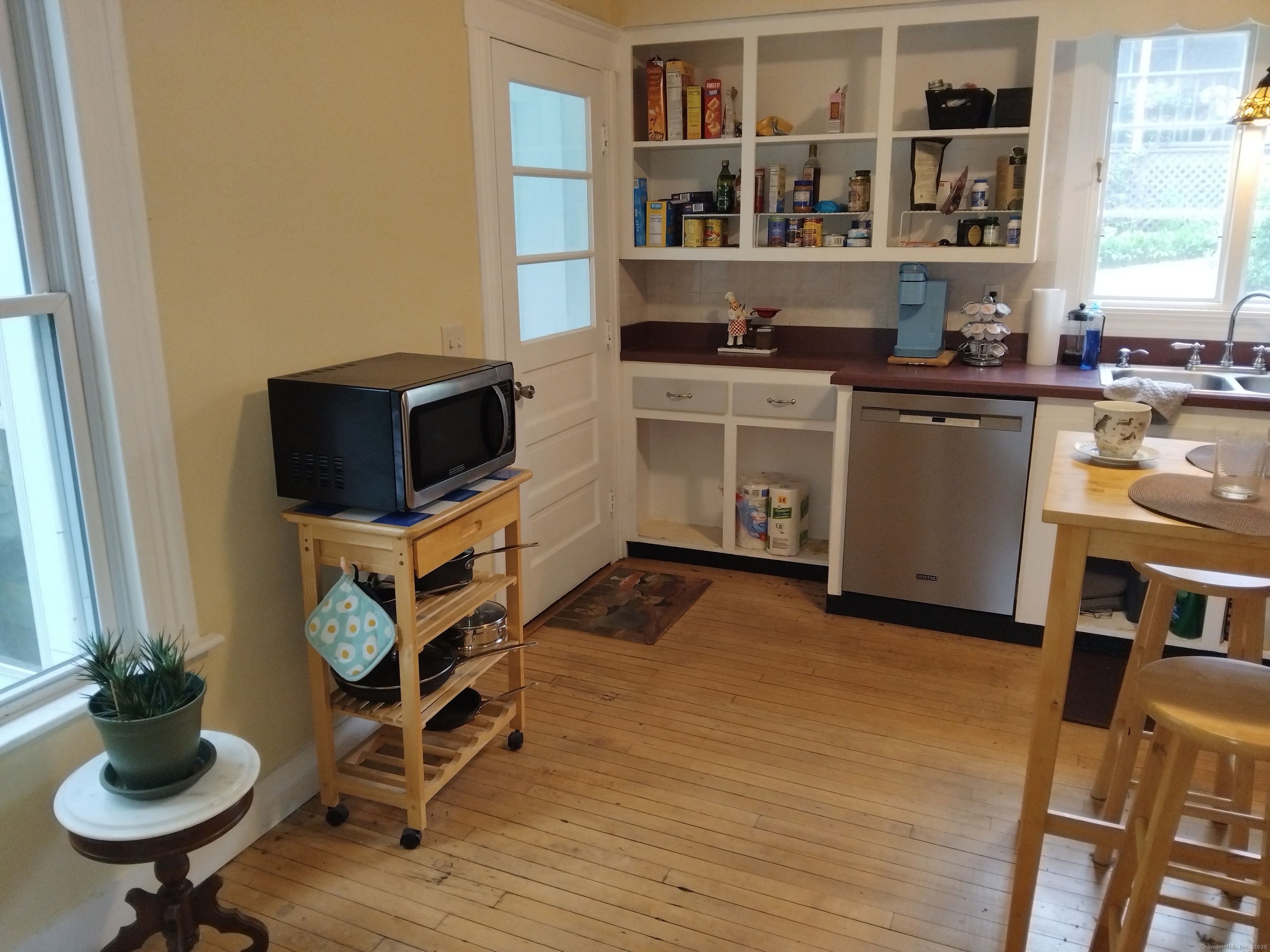 21 Roosevelt Avenue Torrington, CT 06790 - Photo 10 of 22 a kitchen with stainless steel appliances a stove a sink a microwave and cabinets