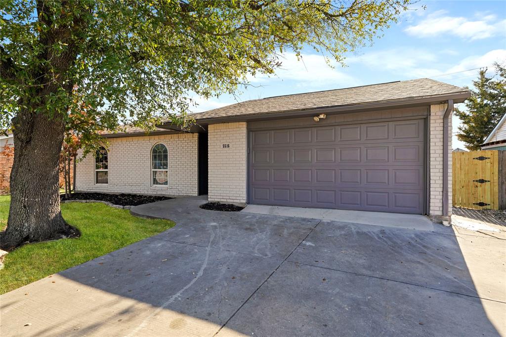 5516 Maple Lane Rowlett, TX 75089 - Photo 2 of 18 a house view with a backyard space