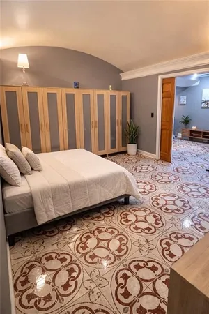 a bedroom with a bed and a walk in closet