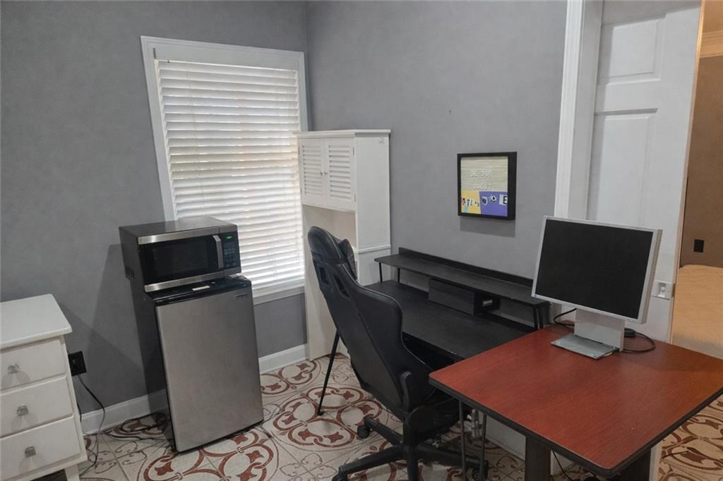 1209 Wildcliff Circle, Unit 100 Atlanta, GA 30329 - Photo 16 of 21 a view of a workspace with furniture