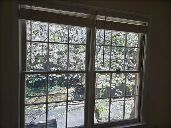 a view of a glass door with a roof deck