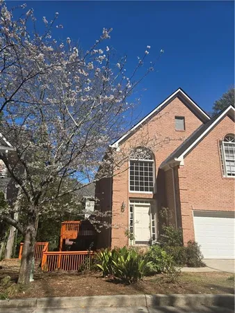 a front view of a house with yard