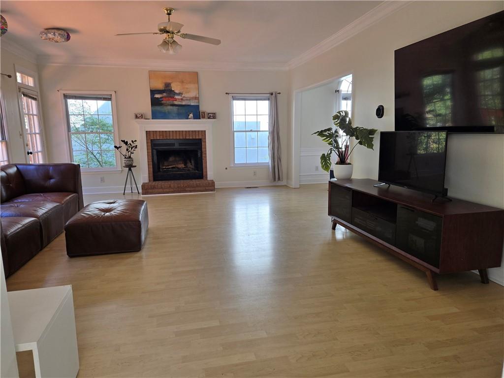 1209 Wildcliff Circle, Unit 100 Atlanta, GA 30329 - Photo 4 of 21 a living room with furniture and a flat screen tv