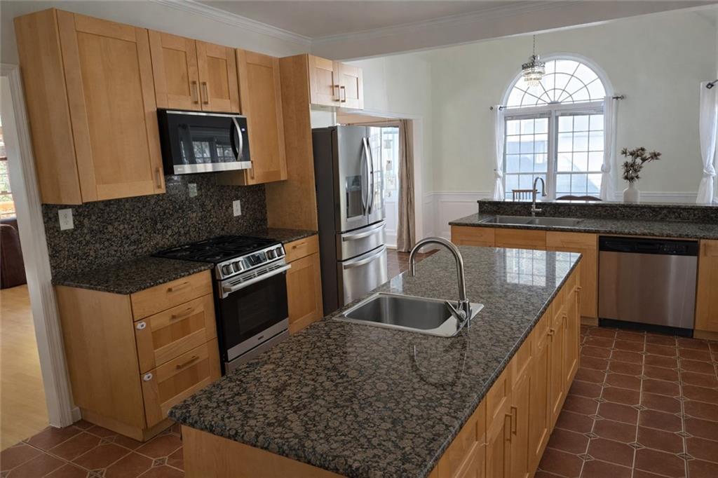 1209 Wildcliff Circle, Unit 100 Atlanta, GA 30329 - Photo 6 of 21 a kitchen with stainless steel appliances granite countertop a sink stove and refrigerator
