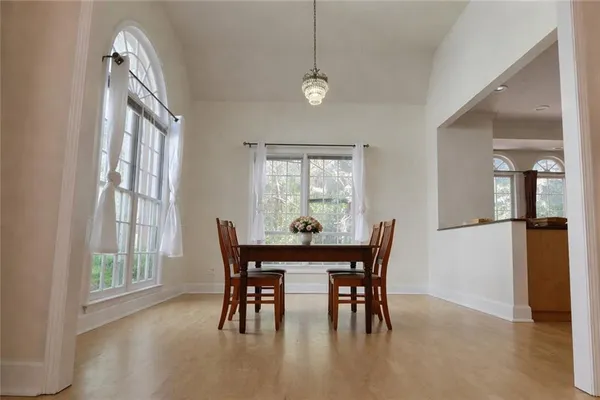 a view of a dining room with furniture and window