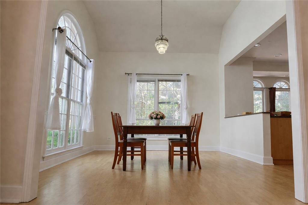1209 Wildcliff Circle, Unit 100 Atlanta, GA 30329 - Photo 7 of 21 a view of a dining room with furniture and window