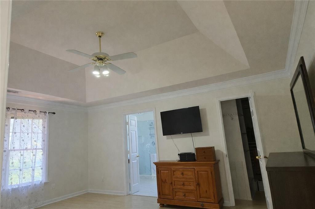 1209 Wildcliff Circle, Unit 100 Atlanta, GA 30329 - Photo 8 of 21 a living room with furniture and a flat screen tv