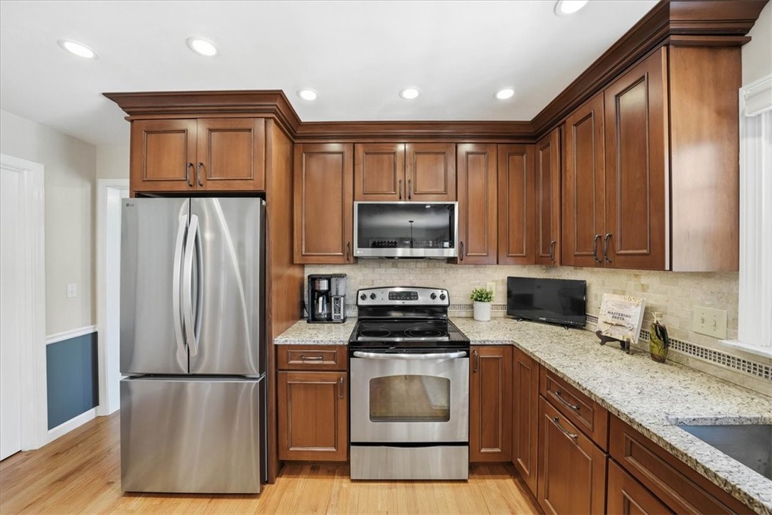 32 Lisa Lane Hopkinton, RI 02832 - Photo 11 of 50 Thoughtfully designed with abundant cabinetry, stainless appliances, and a spacious layout.