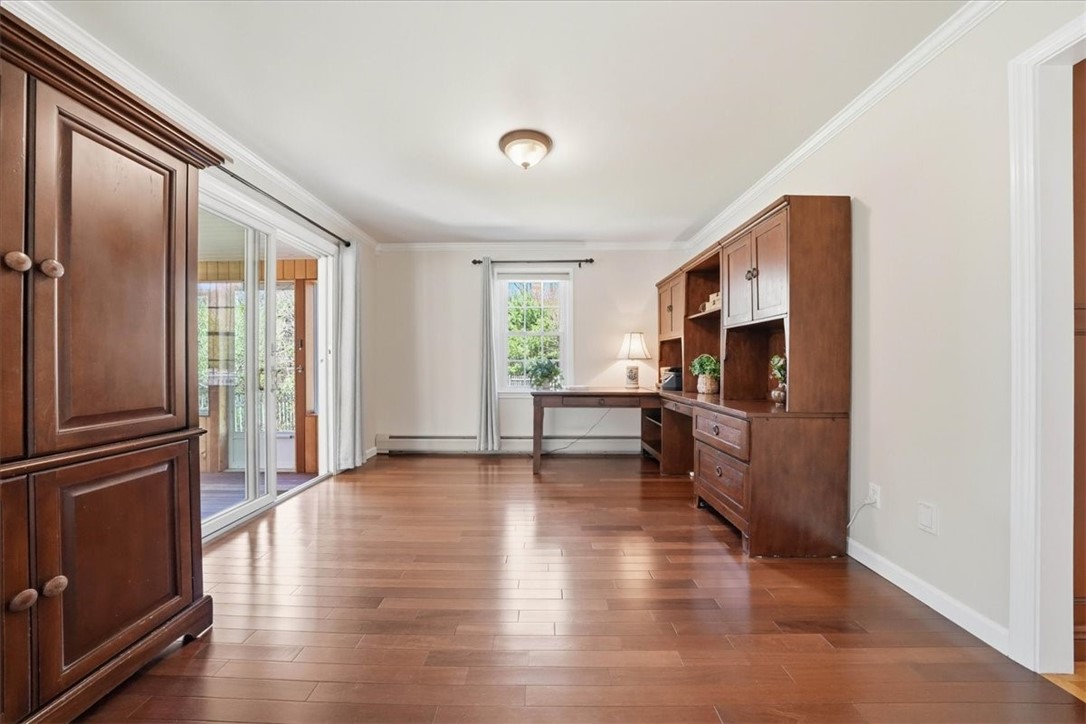 32 Lisa Lane Hopkinton, RI 02832 - Photo 21 of 50 The formal dining room (currently utilized as a stylish and light-filled home office) is located right off the kitchen and flows also from the living room—perfectly blending classic design with modern-day functionality.