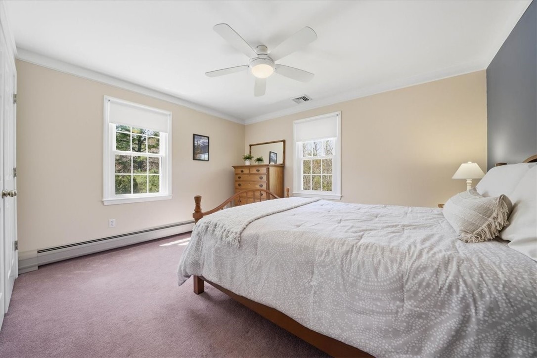 32 Lisa Lane Hopkinton, RI 02832 - Photo 28 of 50 A serene, carpeted bedroom overlooking the backyard, designed for comfort & privacy, complete w/ a spacious double closet & thoughtfully designed storage system.